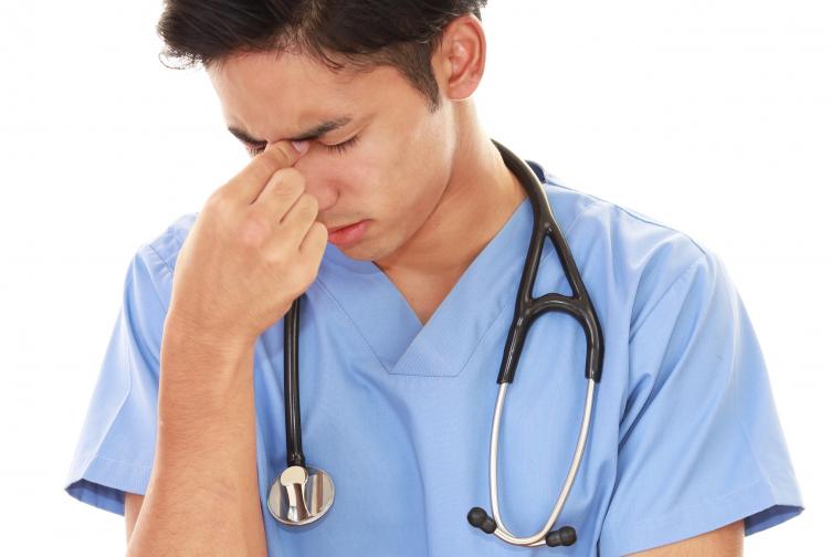 Doctors often suffer in silence Tired doctor