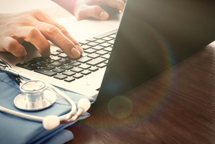 Laptop and clinical notes Laptop and clinical notes